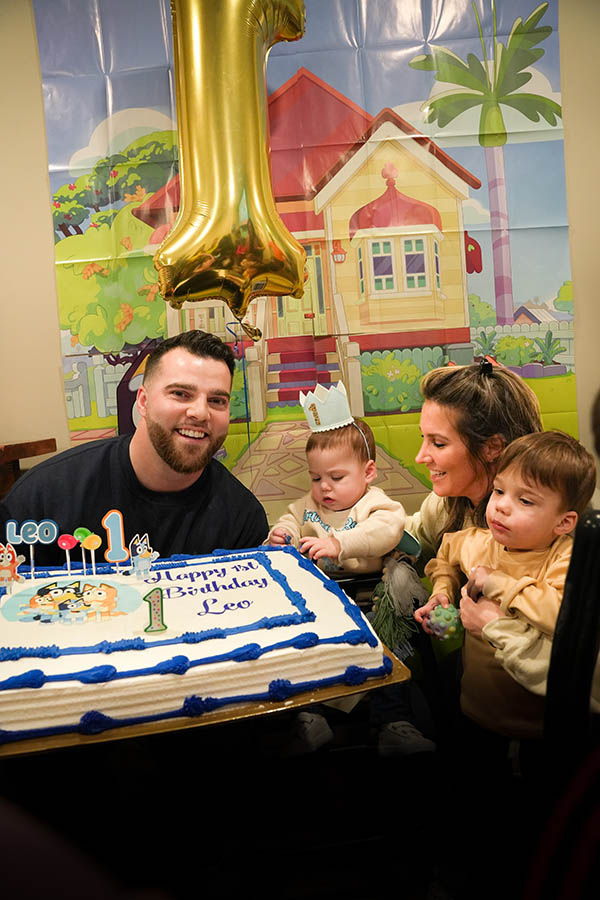 a family with a birthday cake